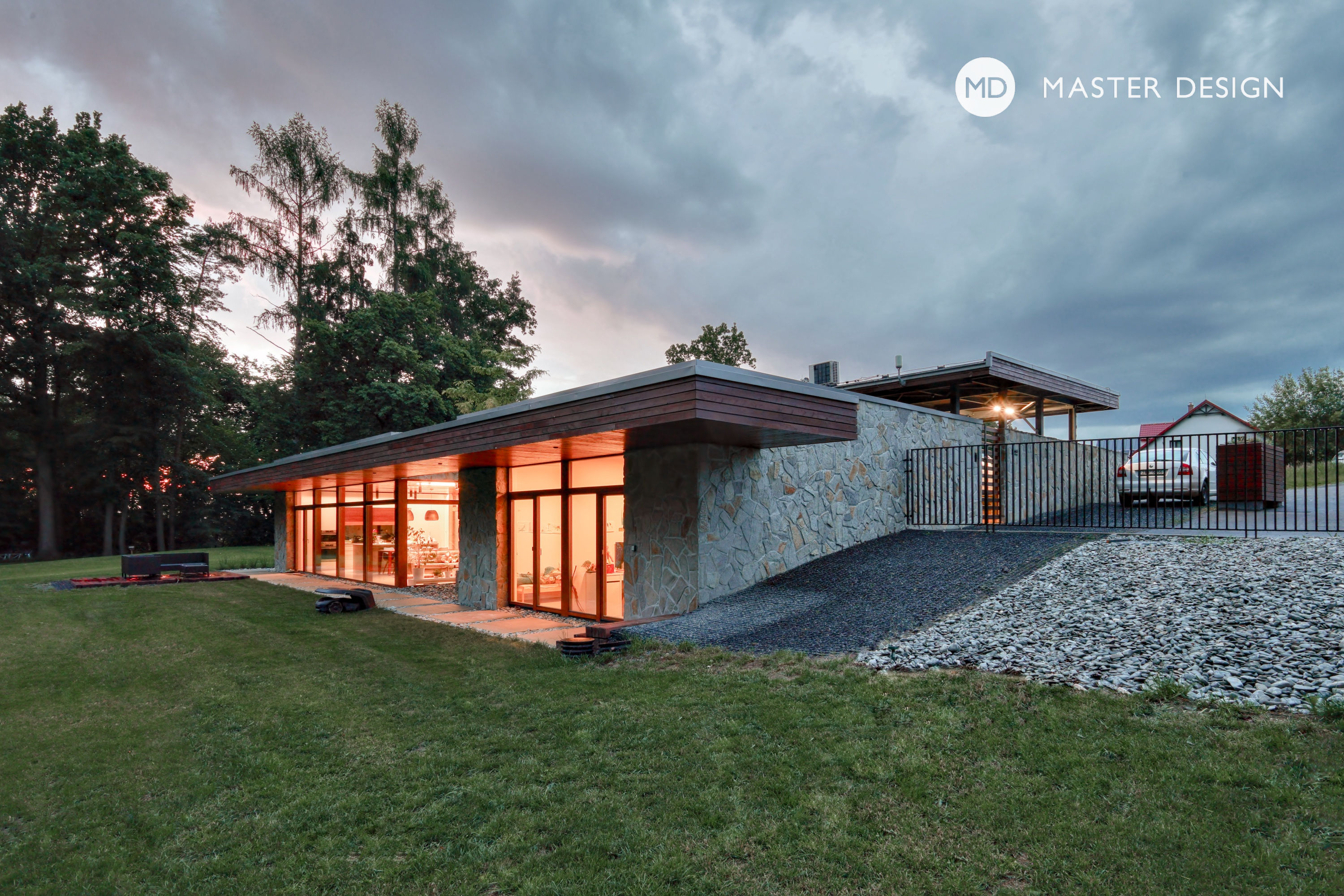 Atrium Cladding Atrium house on a slope with limestone cladding and large windows ...