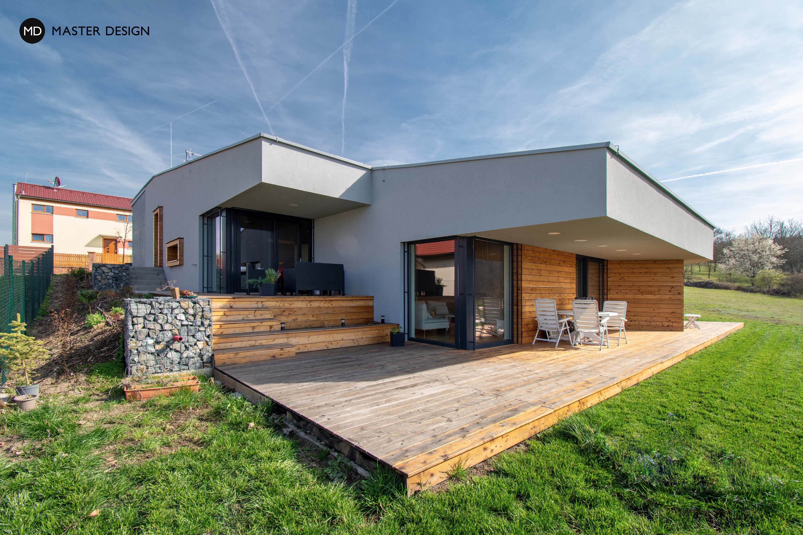 Moderní bungalov ve svahu s pultovou střechou a zastřešenou terasou pro mladou rodinu - Odolená Voda - Vizualizace 3